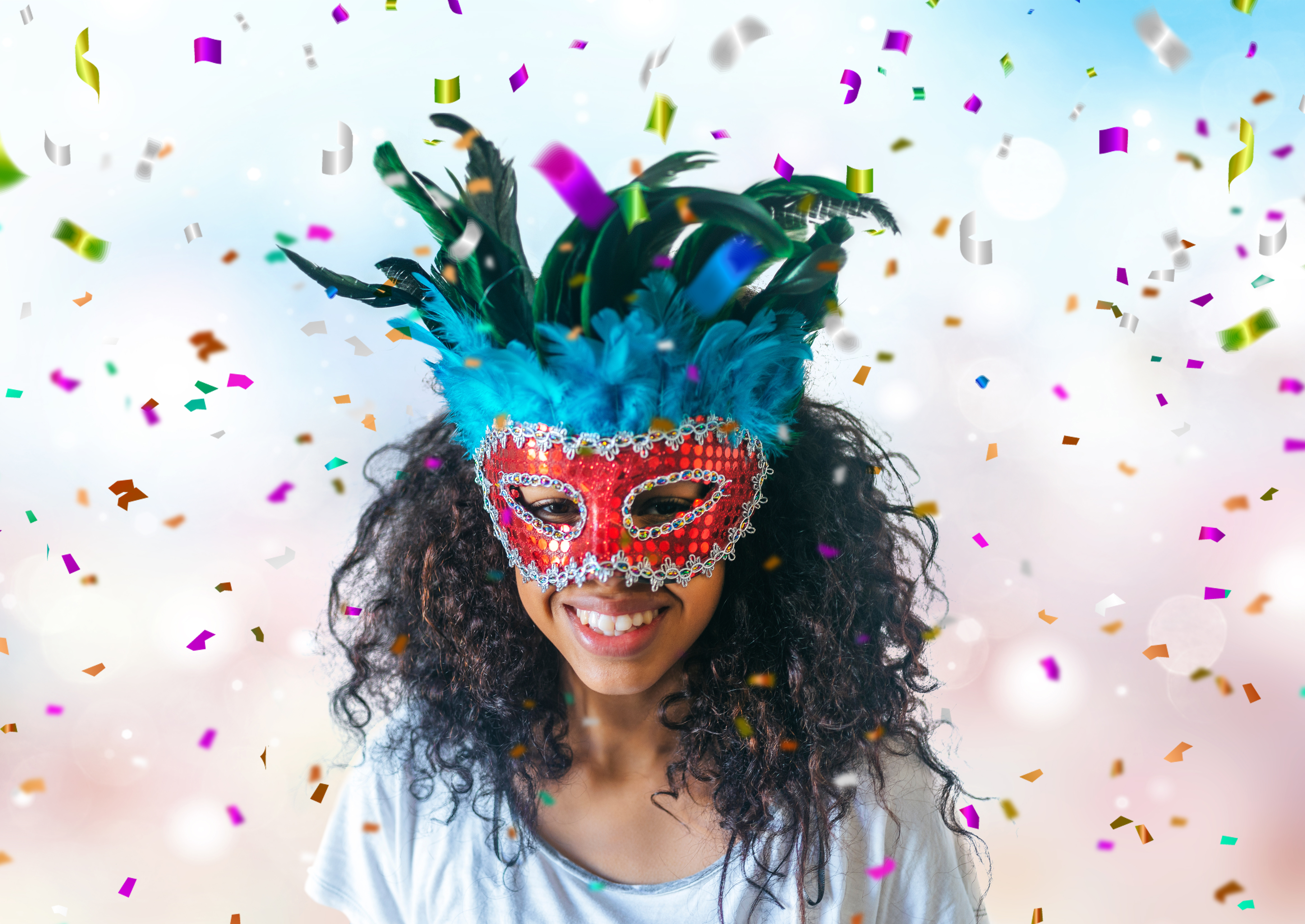March 5 Special Events - Fat Tuesday (Mardi Gras). Woman wearing colorful mask with confetti in the background. 