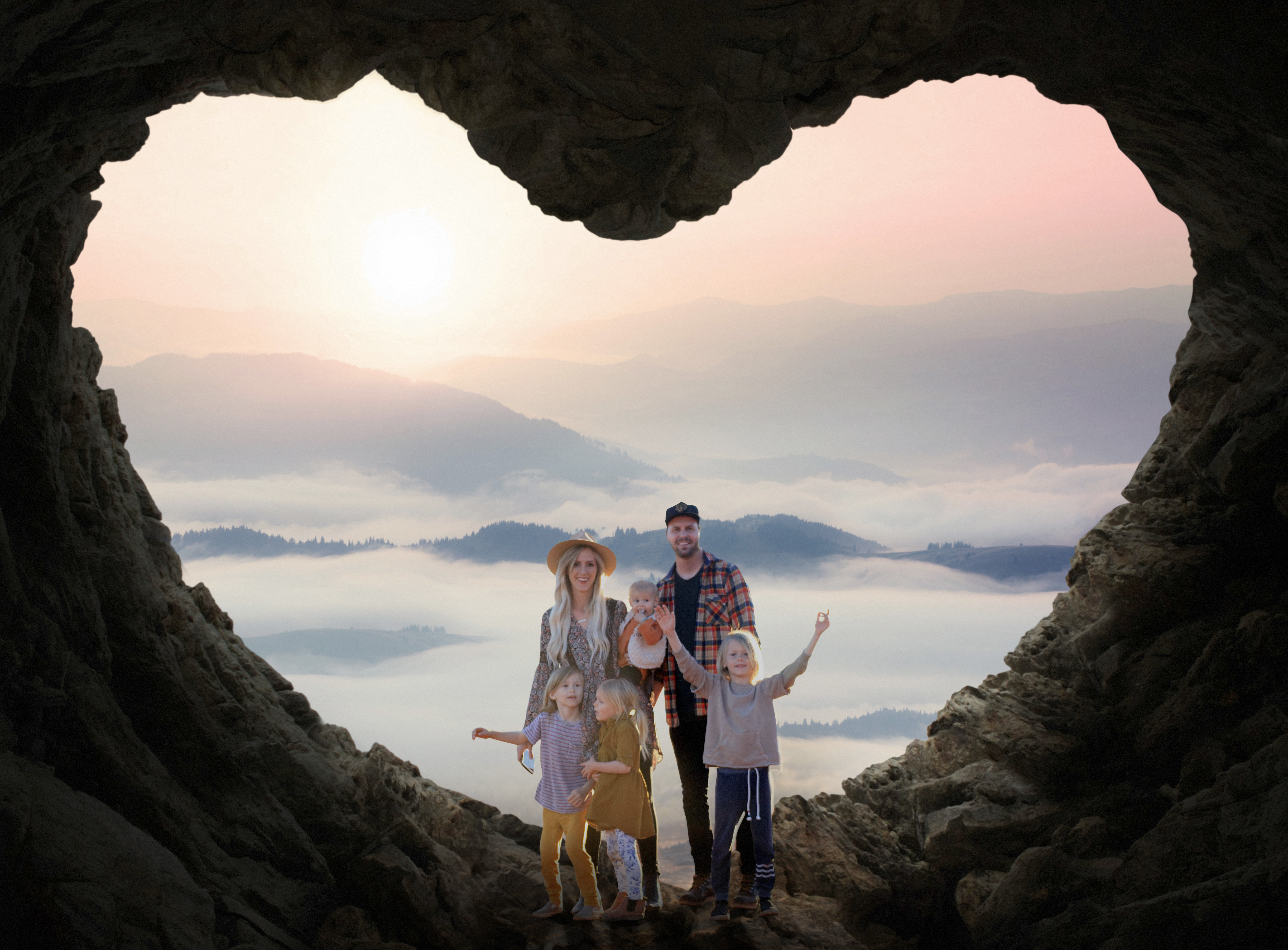 Image of beautiful family placed in a heart shaped cave background. The best photo for your family for valentine's day. 