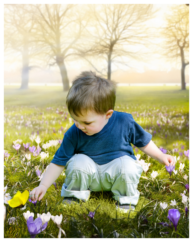 Easter photo of a boy in a field of flowers